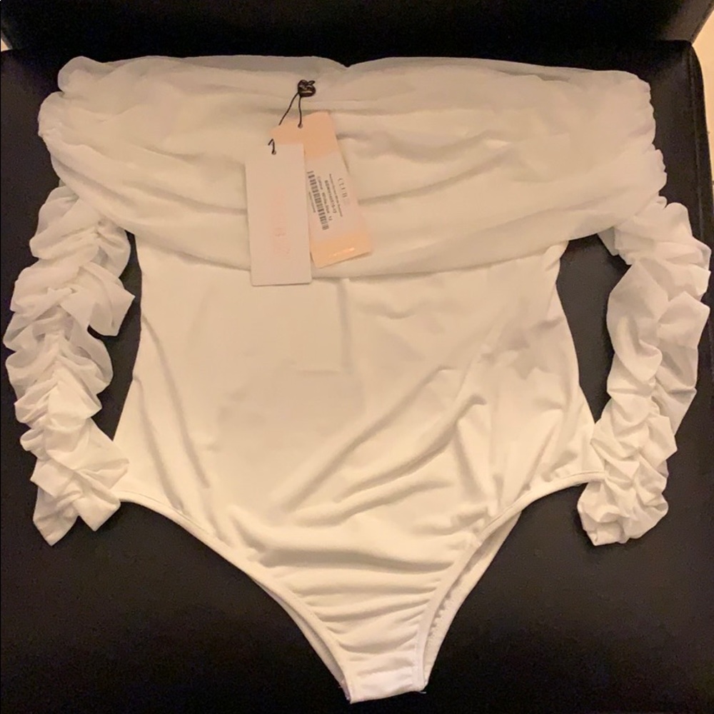 White body suit and a white Tube top